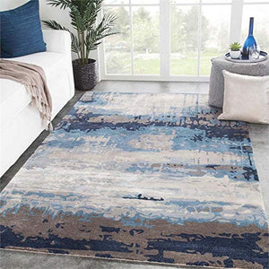 Jaipur Living Genesis 5' x 8' Hand Tufted Area Rug in Blue and Brown